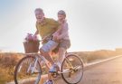 retired couple riding a bike together